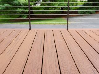 Contractors performing Trex decking screw installation on an outdoor patio in Calabasas.